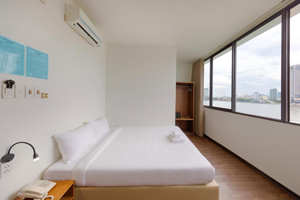 Postel nebo postele na pokoji v ubytování Vitalis Riverside Hotel