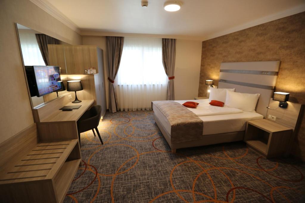 Postel nebo postele na pokoji v ubytování Hotel Baril