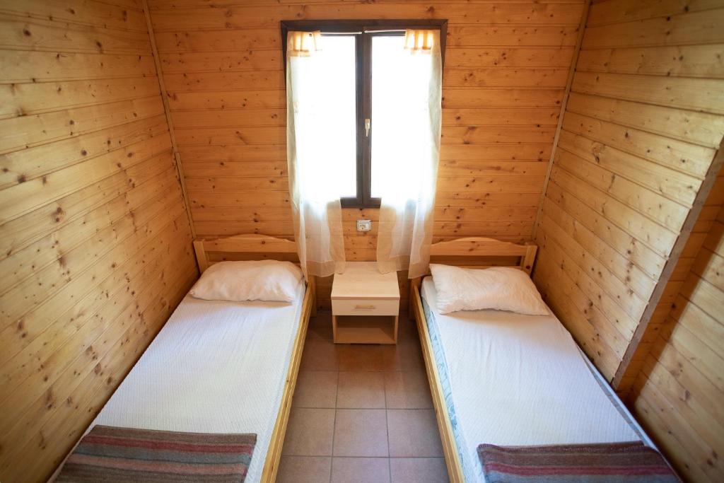 Postel nebo postele na pokoji v ubytování Camping Village Viareggio