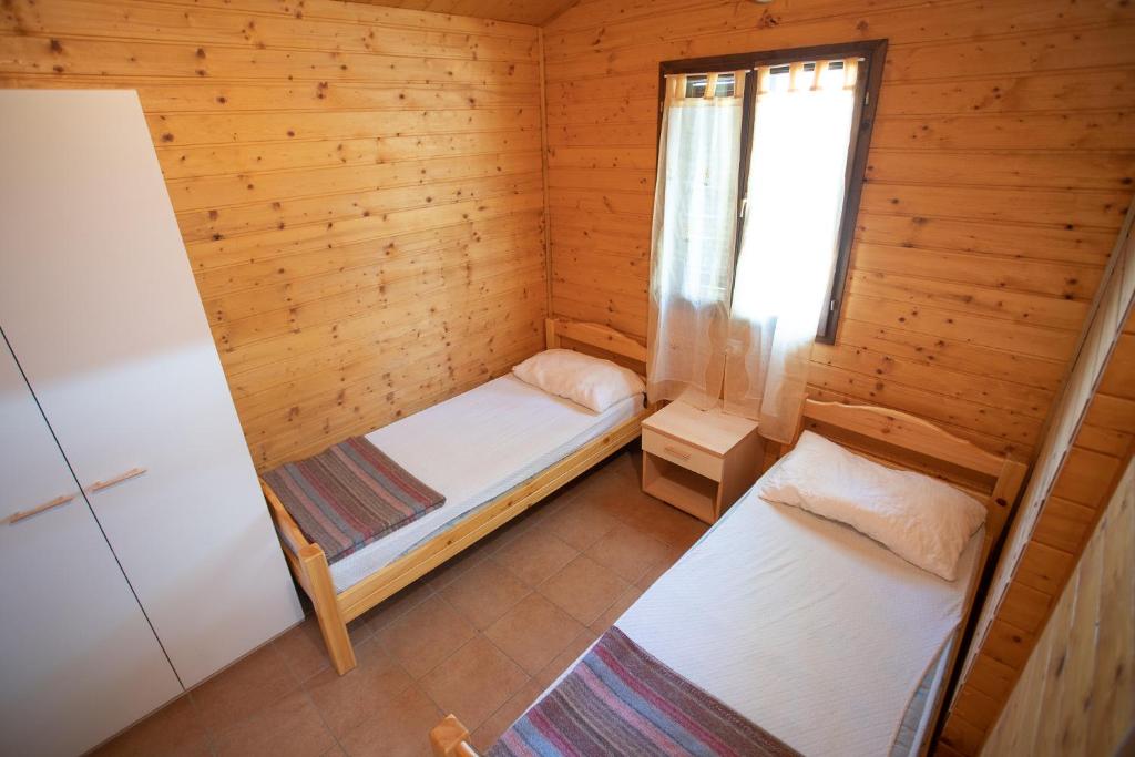 Postel nebo postele na pokoji v ubytování Camping Village Viareggio