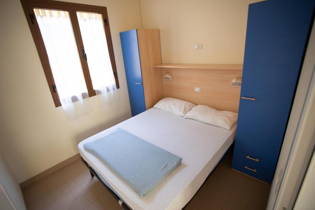 Postel nebo postele na pokoji v ubytování Camping Village Viareggio