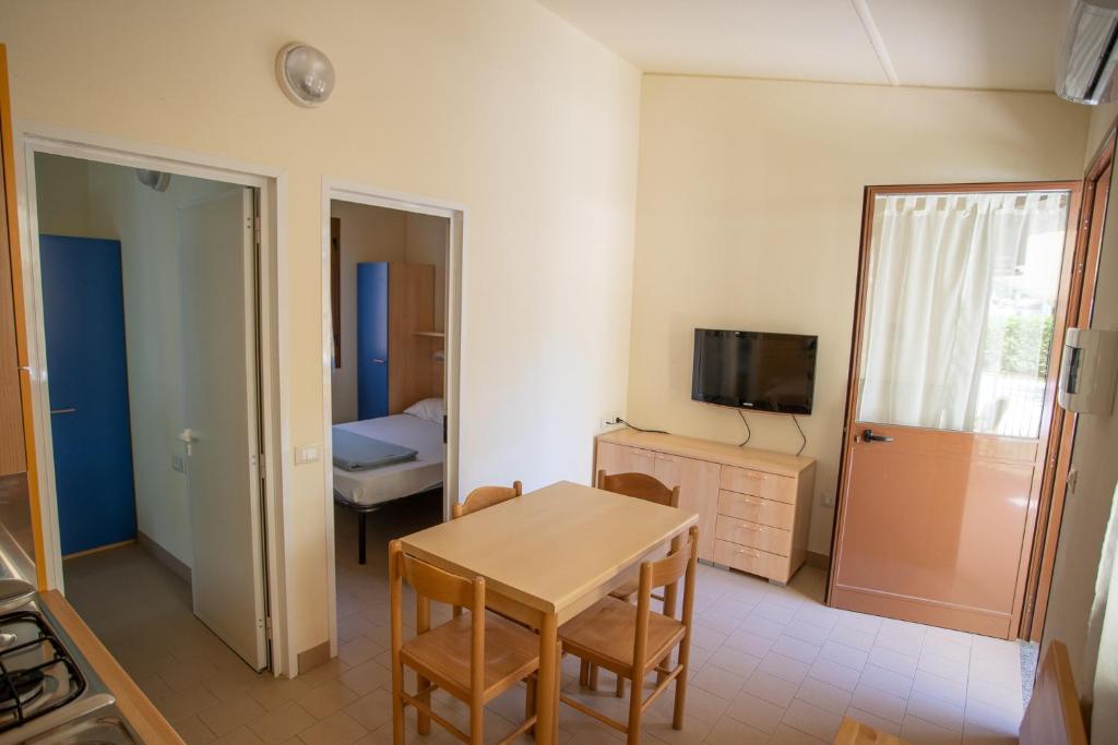 TV a/nebo společenská místnost v ubytování Camping Village Viareggio