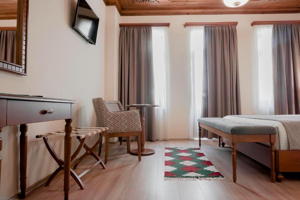 Postel nebo postele na pokoji v ubytování Hotel Argjiro
