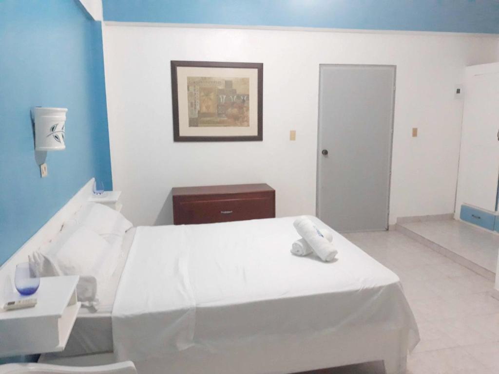 Postel nebo postele na pokoji v ubytování Aparta Hotel Azzurra