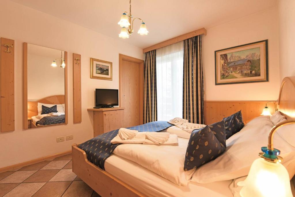 Postel nebo postele na pokoji v ubytování Alpin-Residence Amadeus
