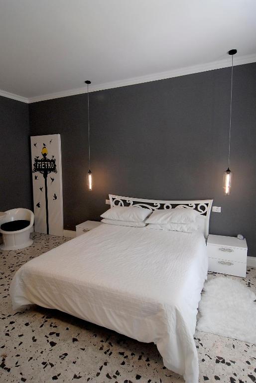 Posteľ alebo postele v izbe v ubytovaní B&B Tiburtina Garden
