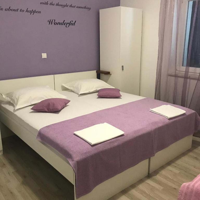 Postel nebo postele na pokoji v ubytování Apartments Nela