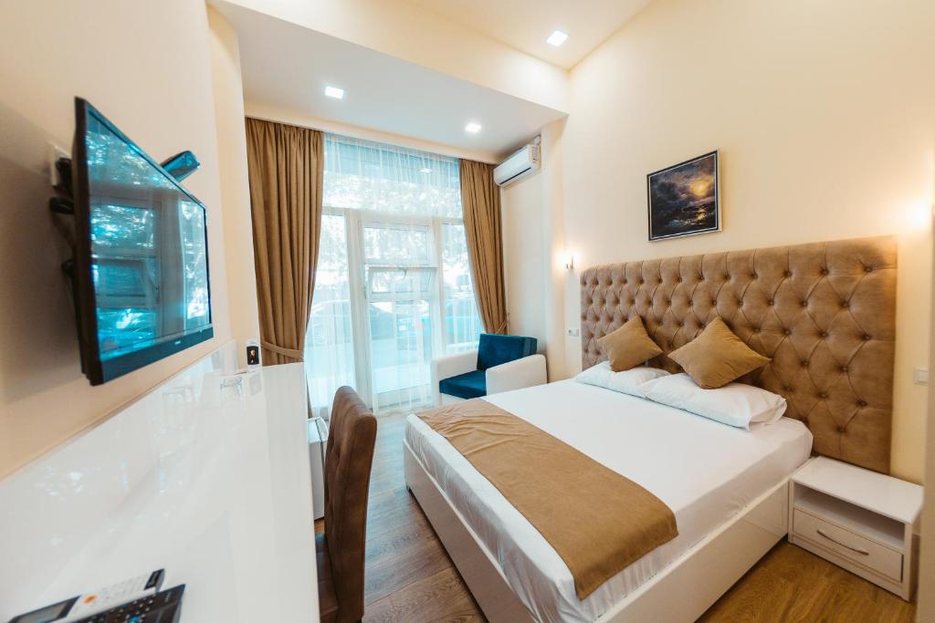 TV a/nebo společenská místnost v ubytování L'image Art Hotel