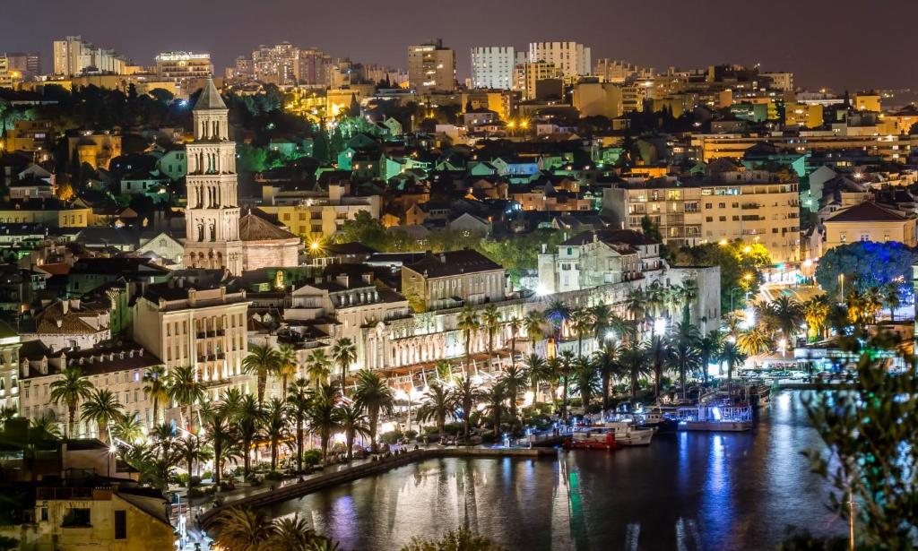 a view of a city at night with a river at Perello Old Town in Split