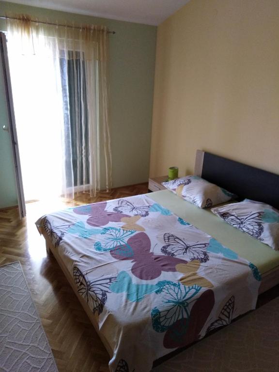 Postel nebo postele na pokoji v ubytování Apartment Ivo