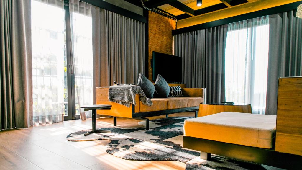 Posezení v ubytování Vino Neste Private Pool Villas