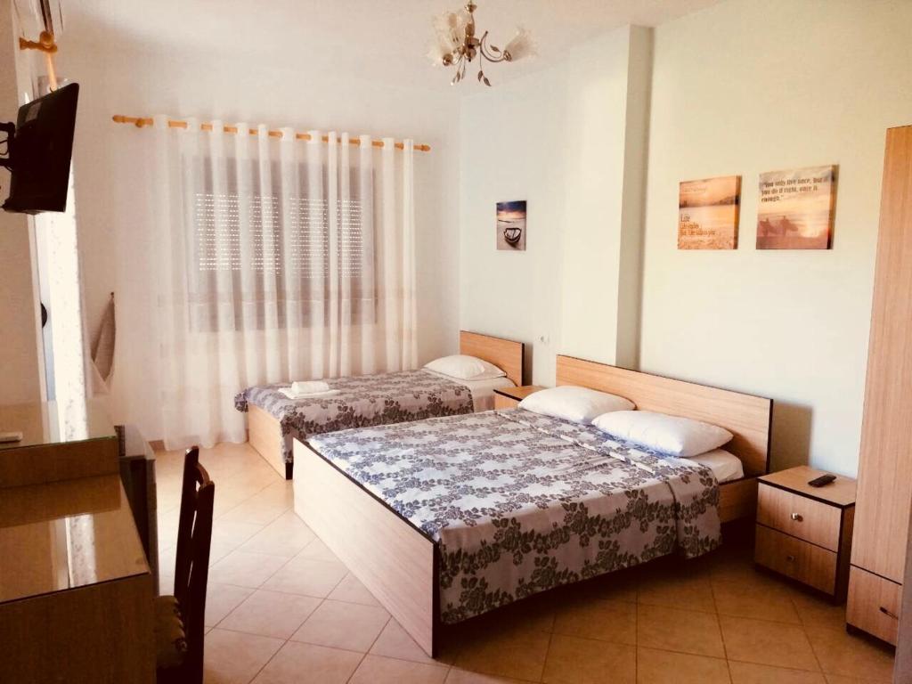 Postel nebo postele na pokoji v ubytování Ilion Hotel