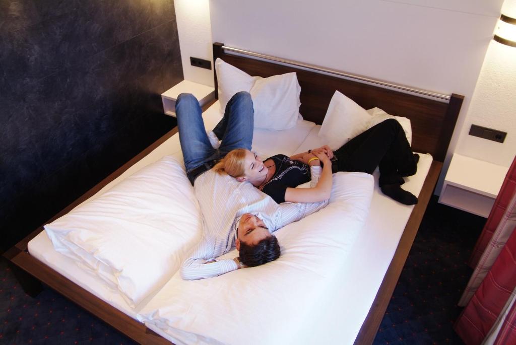 Posteľ alebo postele v izbe v ubytovaní Astellina hotel-apart
