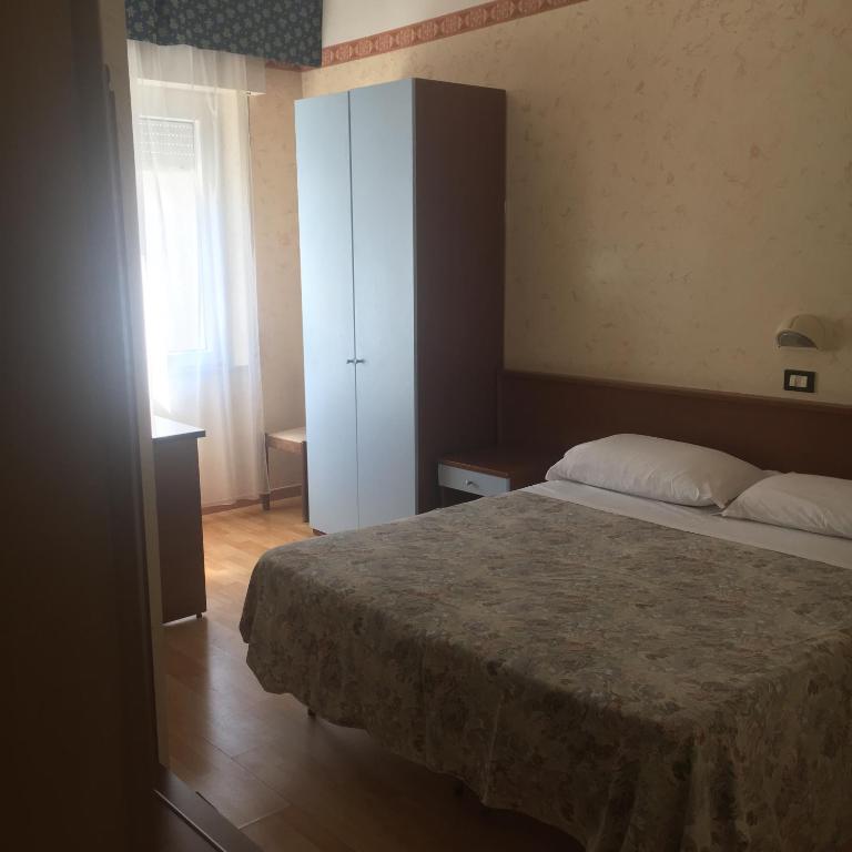 Postel nebo postele na pokoji v ubytování Hotel Alexander Resort