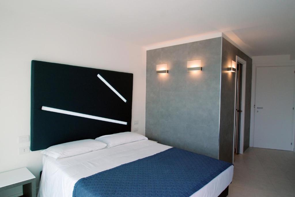 Postel nebo postele na pokoji v ubytování Lungotevere Suite