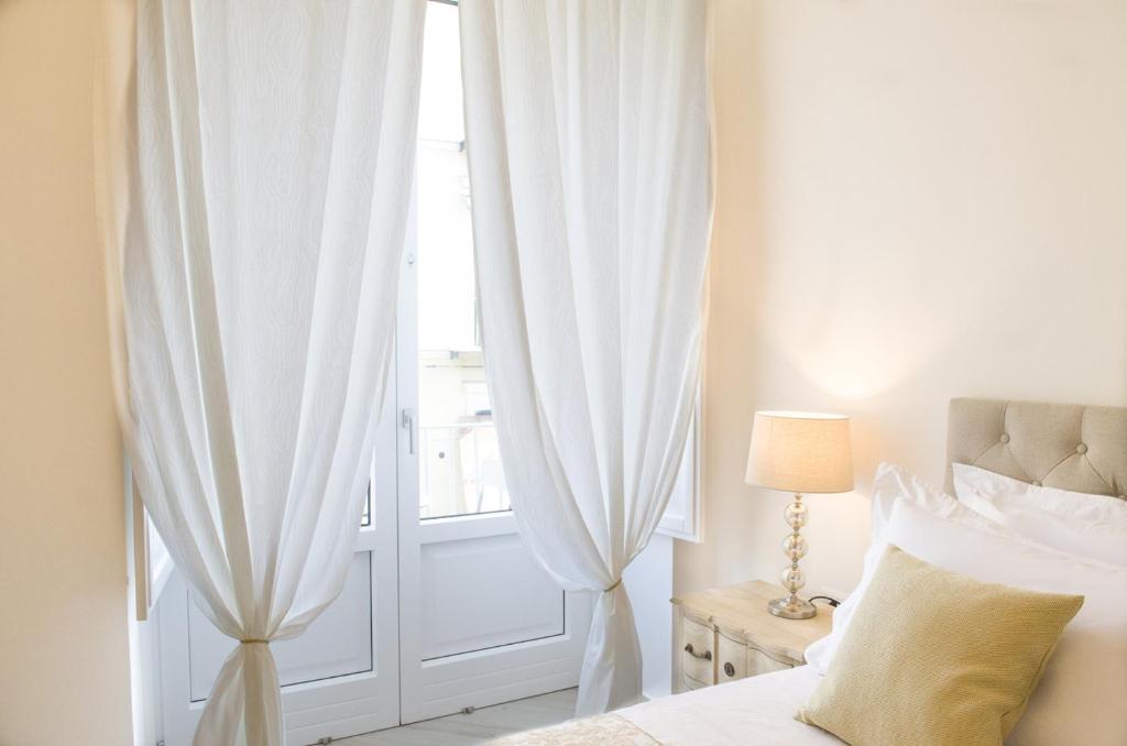 Posteľ alebo postele v izbe v ubytovaní Palazzo Spasiano rooms - SORRENTO CENTER
