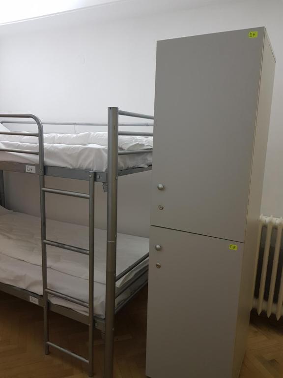 Postel nebo postele na pokoji v ubytování Sleep Inn Hostel