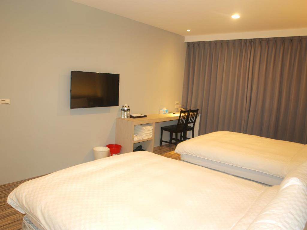 Postel nebo postele na pokoji v ubytování Taimali Hotel