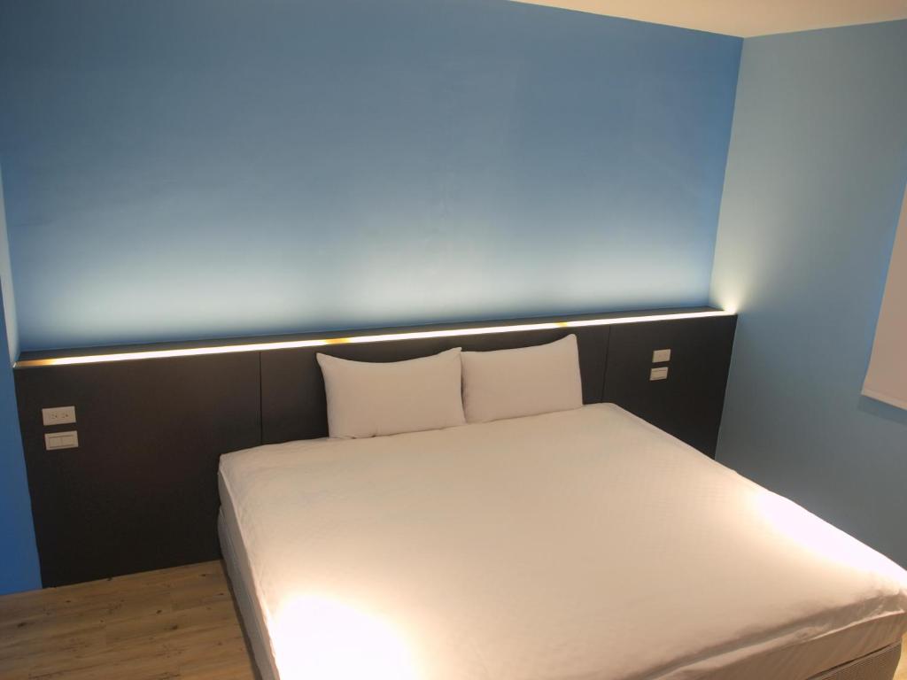 Postel nebo postele na pokoji v ubytování Taimali Hotel