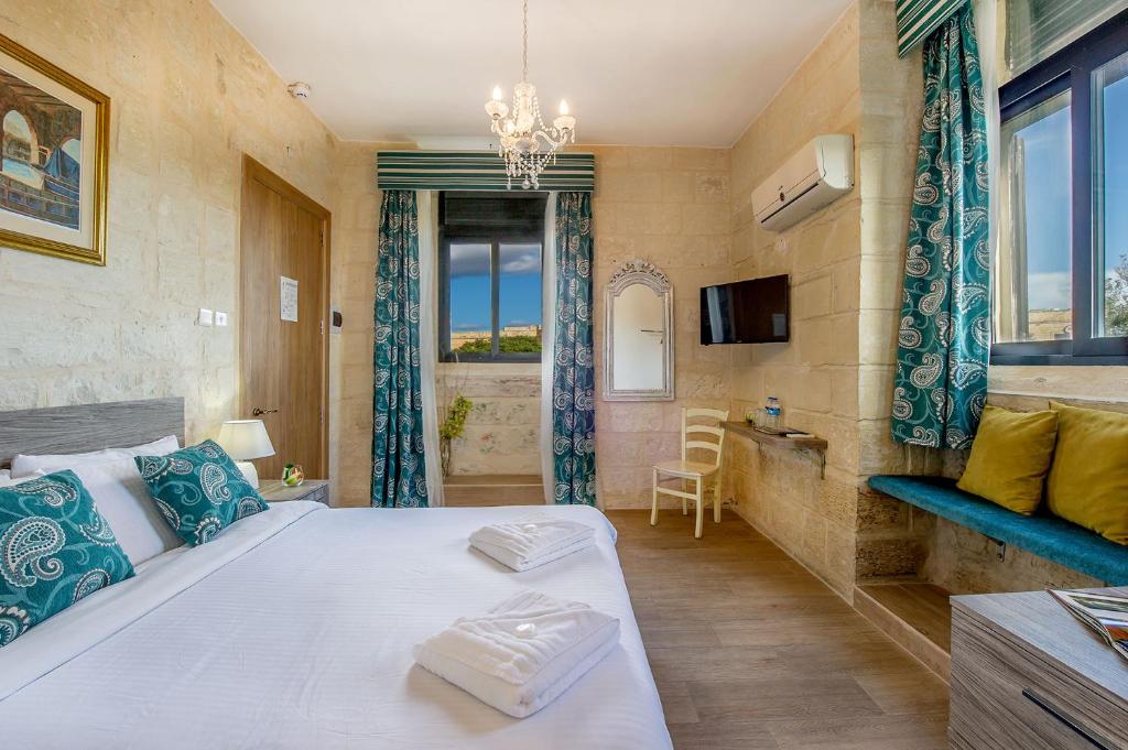 Łóżko lub łóżka w pokoju w obiekcie Point de vue Guesthouse