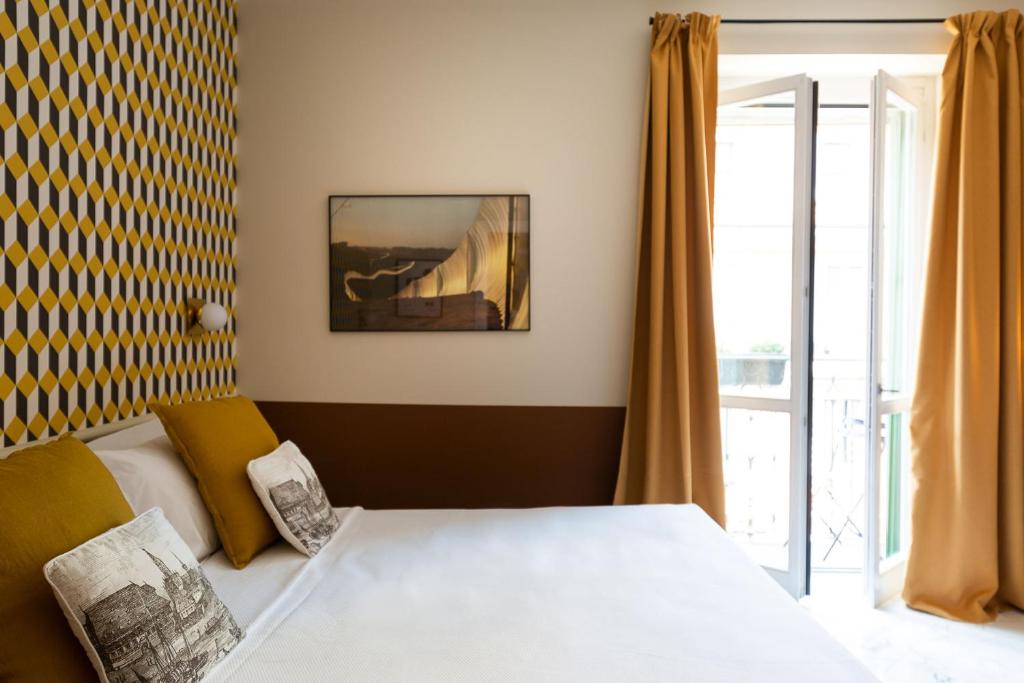 A bed or beds in a room at Zebra Naviglio