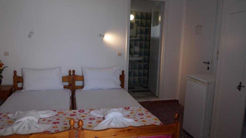 Postel nebo postele na pokoji v ubytování Hotel Hara