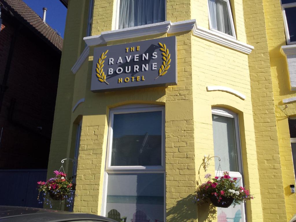 a building with a sign for the ravens bounce hotel at The Ravensbourne Hotel in Bournemouth