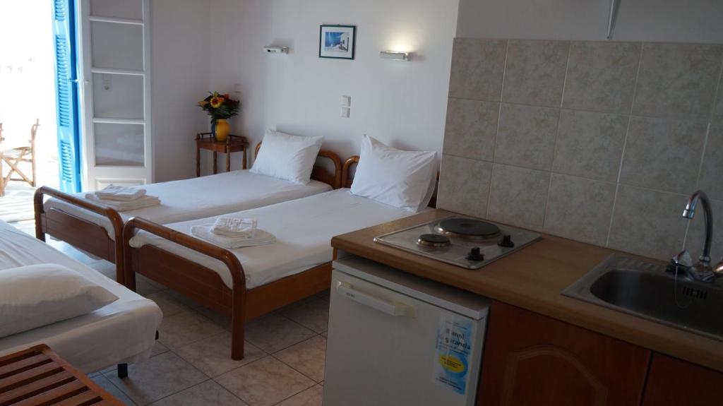 Postel nebo postele na pokoji v ubytování Hotel Hara