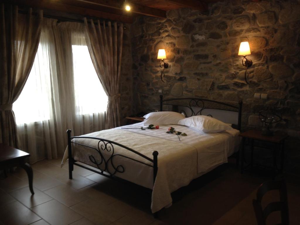 Postel nebo postele na pokoji v ubytování The View Village - Villas Suites & Spa