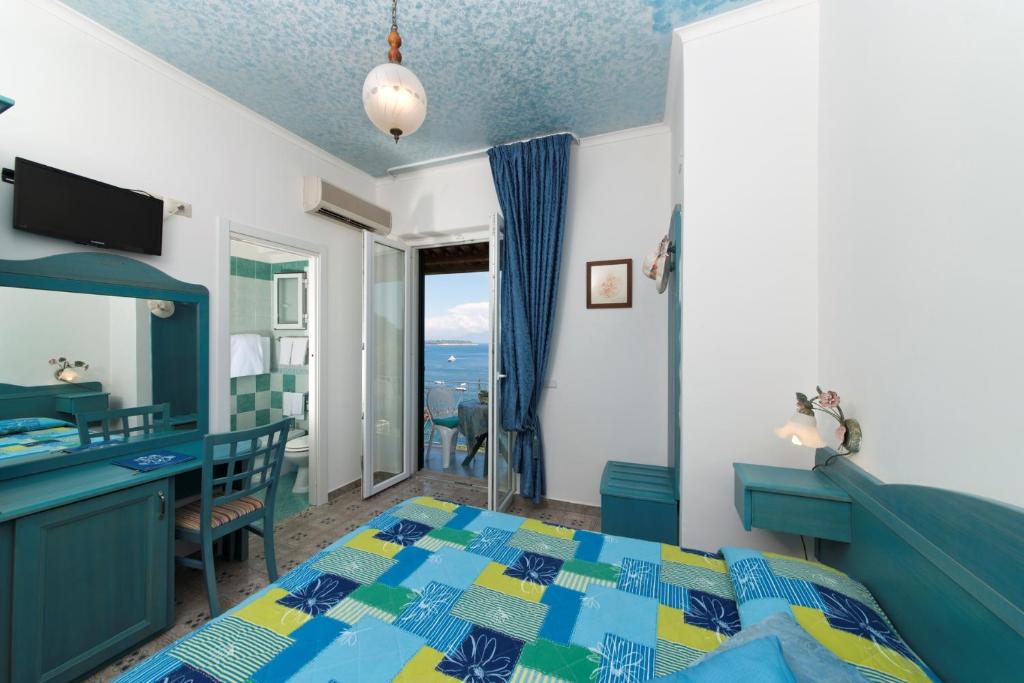 Postel nebo postele na pokoji v ubytování Hotel Giardino Delle Ninfe E La Fenice