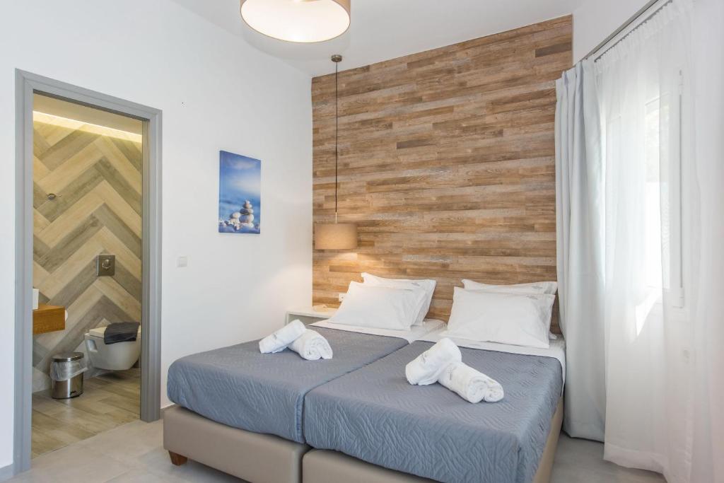 Postel nebo postele na pokoji v ubytování Dimamiel Malia Inn