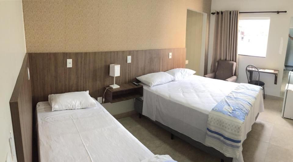 Voodi või voodid majutusasutuse Hotel Redentora Plaza toas