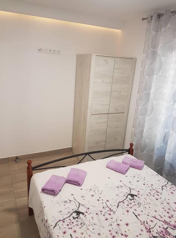 Posteľ alebo postele v izbe v ubytovaní Niko apartment