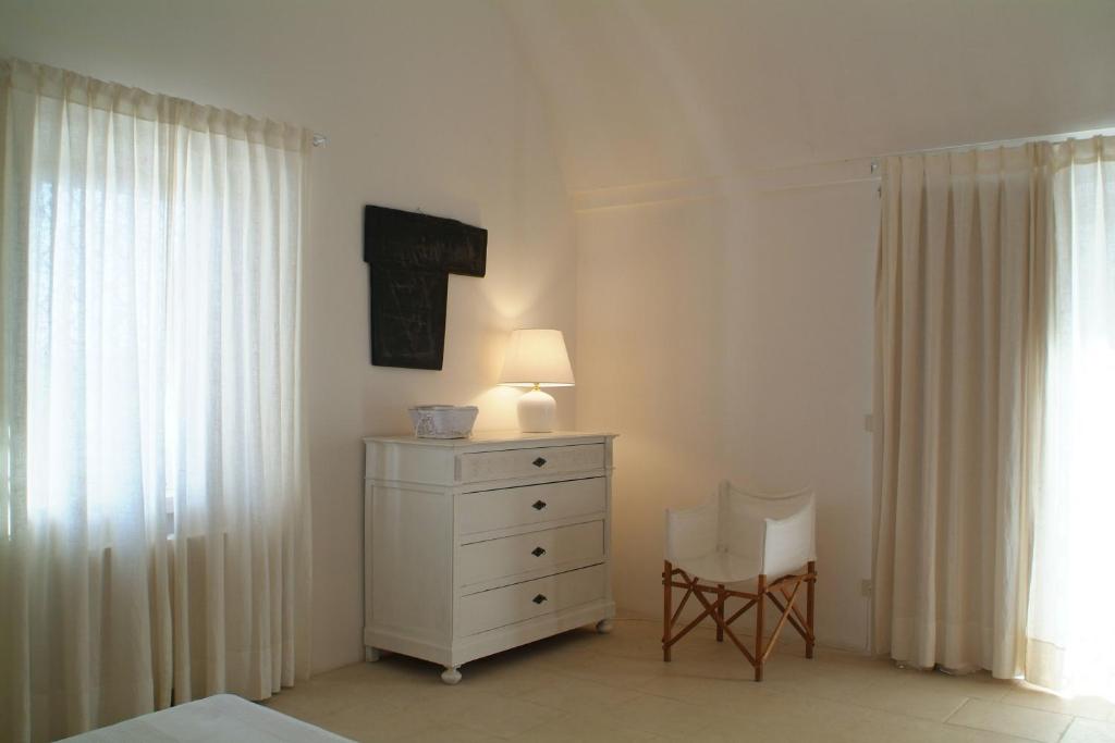 A bed or beds in a room at Masseria Frassaniti