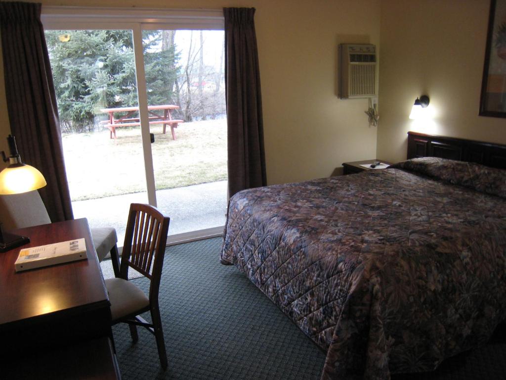 Postel nebo postele na pokoji v ubytování Johnny's Motel