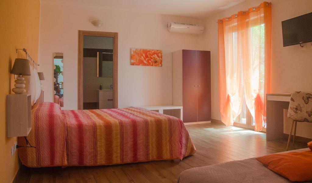 Postel nebo postele na pokoji v ubytování Baia Benessere B&B Eco Vegan