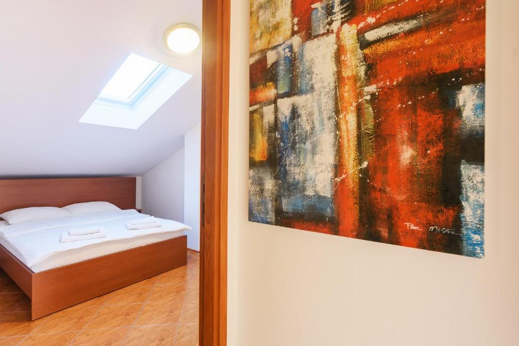 Postel nebo postele na pokoji v ubytování Apartmani "Jadran"