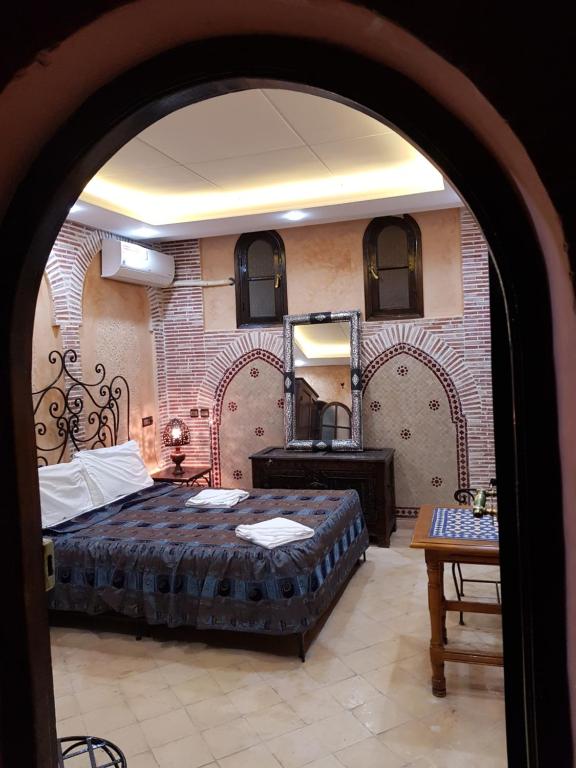 Postel nebo postele na pokoji v ubytování Hotel Salsabil