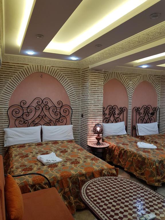 Postel nebo postele na pokoji v ubytování Hotel Salsabil