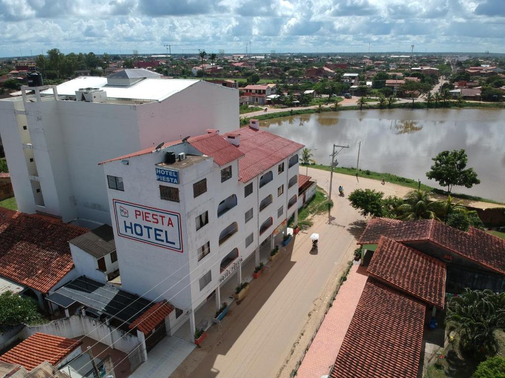 an aerial view of a hotel next to a river at Hotel Piesta in Trinidad