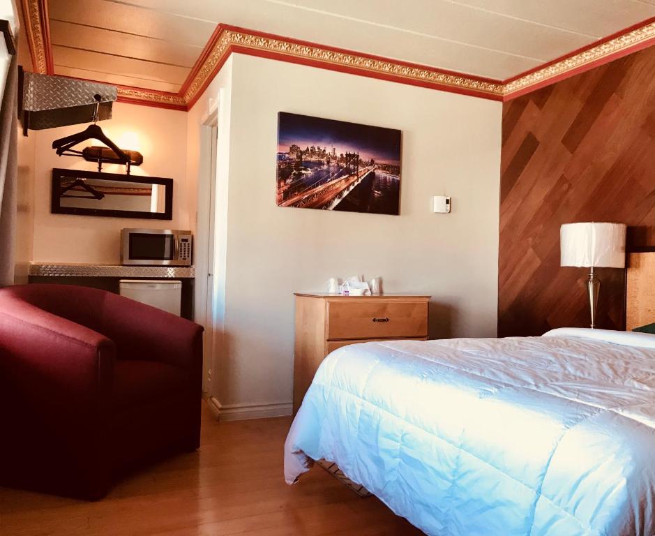 Postel nebo postele na pokoji v ubytování Motel Bellefeuille