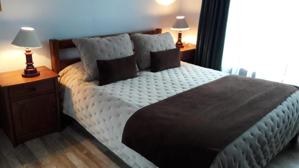 Postel nebo postele na pokoji v ubytování Hotel y Cabañas Molino Viejo