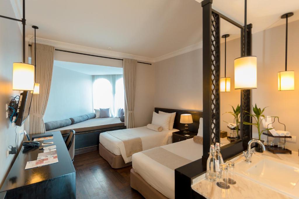 Postel nebo postele na pokoji v ubytování Sarai and Wander Hotel