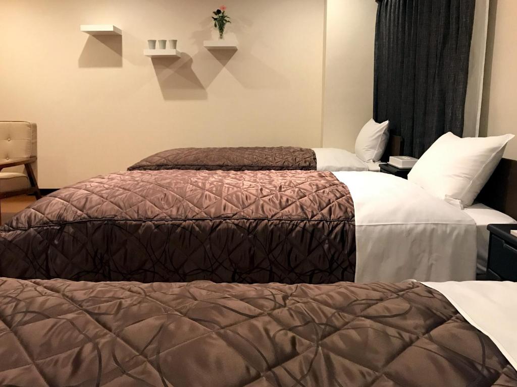Cama o camas de una habitación en E Hotel Warabi
