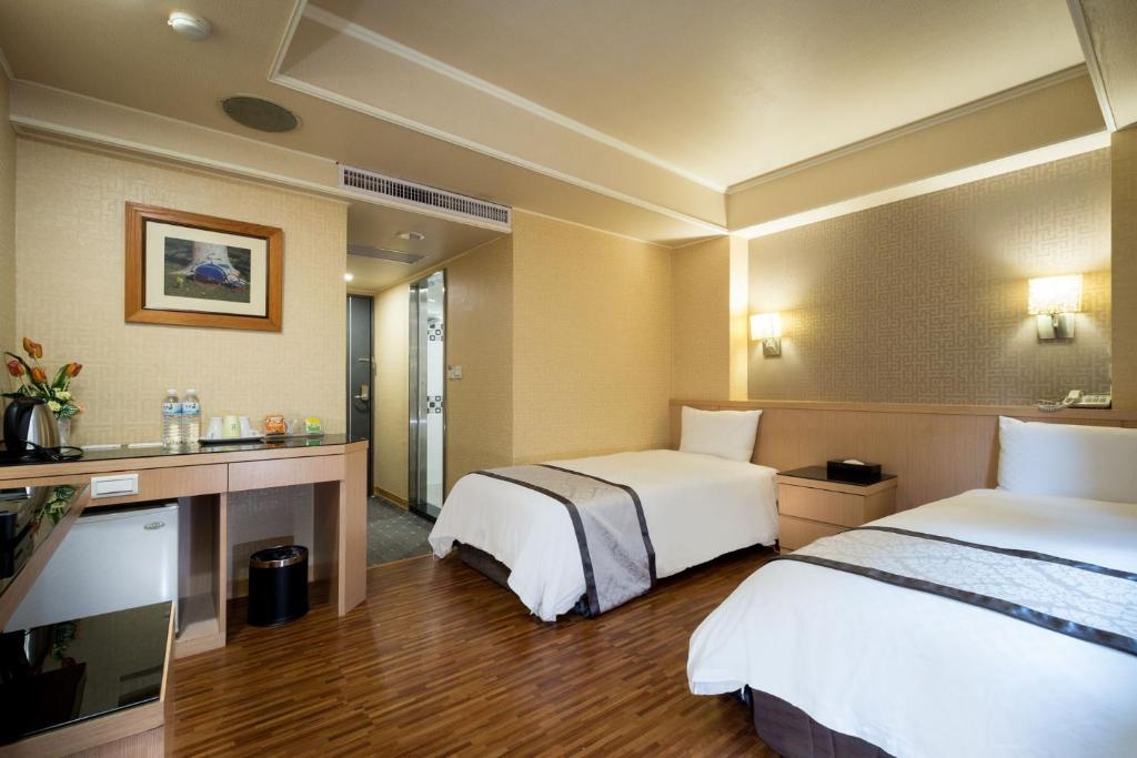 Postel nebo postele na pokoji v ubytování Good Life Hotel - Shang Hwa