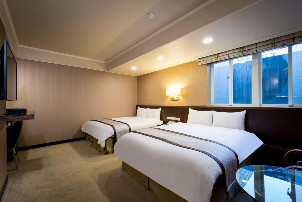 Postel nebo postele na pokoji v ubytování Good Life Hotel - Shang Hwa