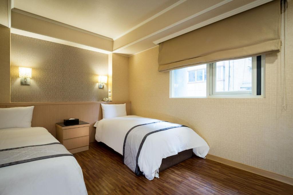 Postel nebo postele na pokoji v ubytování Good Life Hotel - Shang Hwa