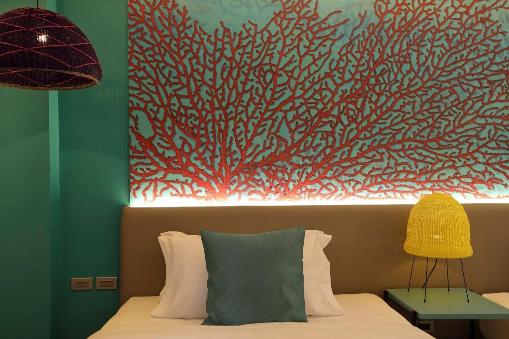 Llit o llits en una habitació de Lagùn Hotel