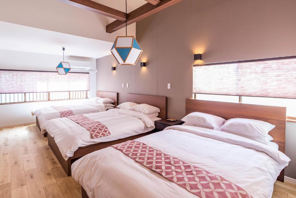 Ένα ή περισσότερα κρεβάτια σε δωμάτιο στο Bijou Suites Musubi