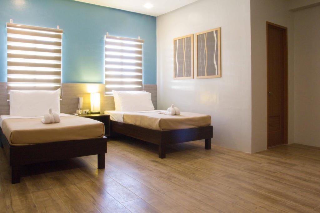 Postel nebo postele na pokoji v ubytování Sheridan Boutique Hotel